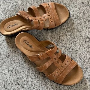 Clark’s slip on sandal in leather tan, never worn size 5